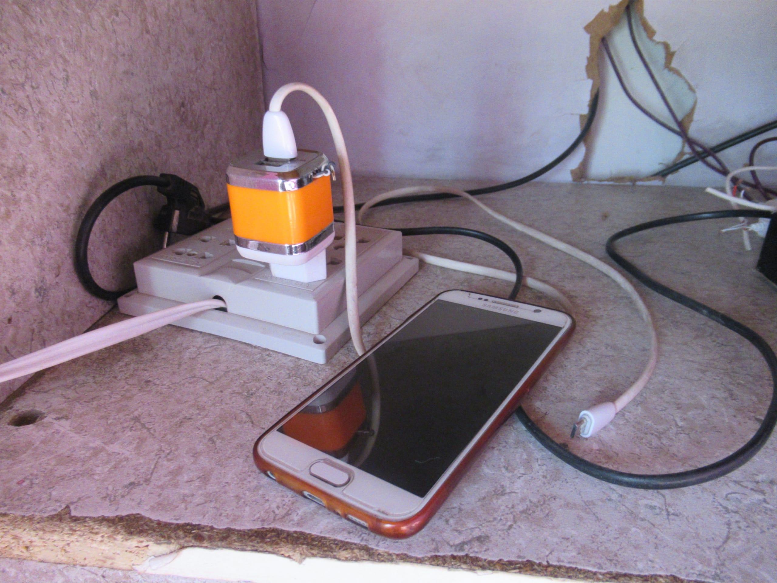 There is no way to charge a phone without having access to electricity.