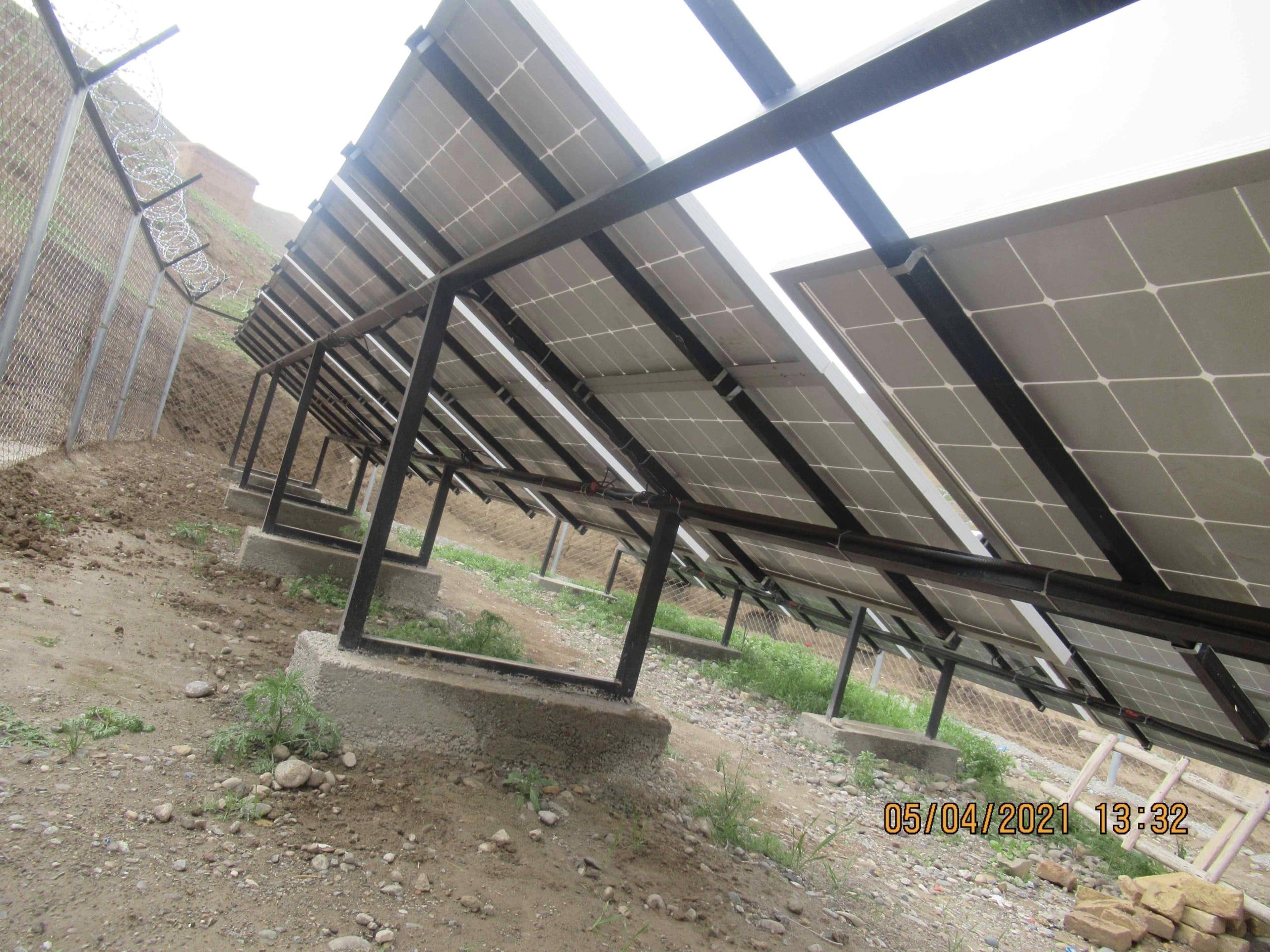 Ground-mounted structure placed in concrete and no cables visible - perfect installation of this PV plant.